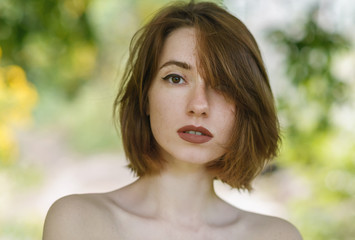 Fototapeta premium Portrait of beautiful sensual woman with freckles.