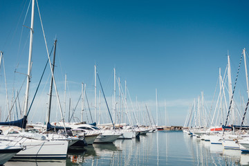 Yacht parking in harbor, harbor yacht club in Marina di Scarlino, Italy. Beautiful Yachts in blue...