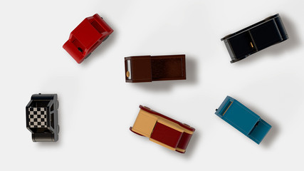 Bunch of wood toy cars isolated on white. Top view. 3D render. 