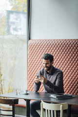 Feelance Businessman Working from Restaurant