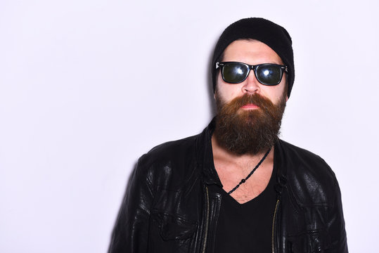 Rock fan or gangster in sunglasses. Guy with beard