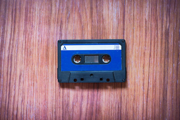Fototapeta premium Old cassette tapes with a wooden background