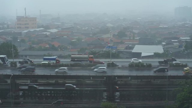 Heavy rains look down at the highway bridge in Jakarta.