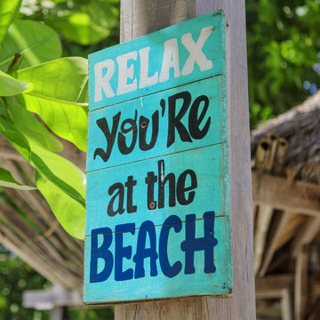 Relax, you're at the beach - wooden sign