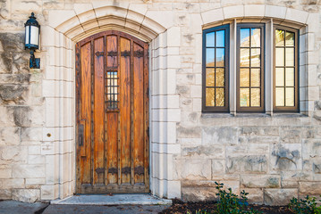 Wooden door and window on the stone facade of historic building, Atlanta, USA
