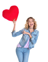 Fototapeta na wymiar Attractive young woman with red heart on white background