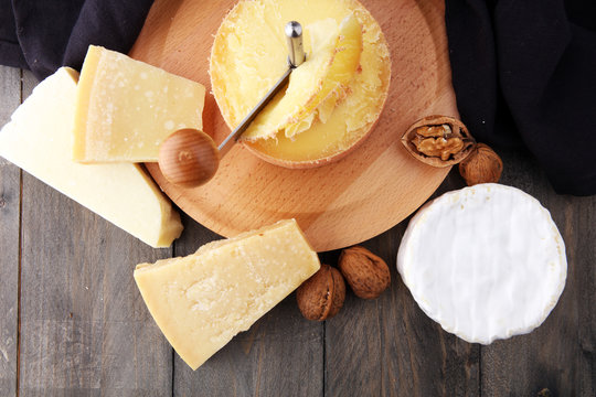 Special cheese knives. The girolle scraper in cheese wheel. Cheese shaving decoration.