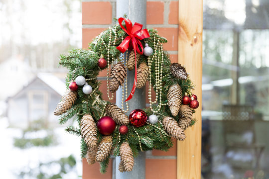 Christmas door wreath with pines and Christmas decorations