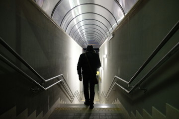 man walks in the underpass