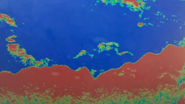 close up of the screen of a depth sounder on a fishing charter boat