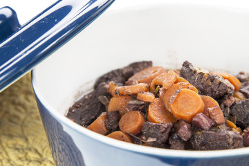 Beouf Bourguignon stew in a blue casserole dish
