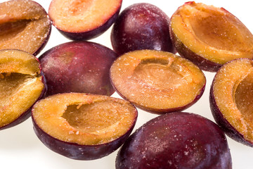 luscious frozen plum without pit isolated on white background, delicious first class organic fruit as a concept of summer vitamins