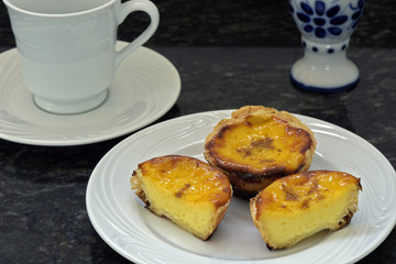 Pasteis de Belem or pasteis de nata in white plate