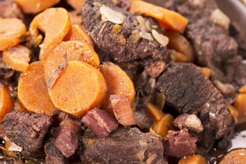 Beouf Bourguignon stew in a blue casserole dish