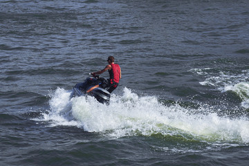 Fototapeta na wymiar Young Man on Jet Ski