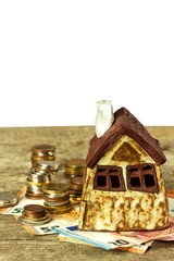 Model of a family house. Concept of mortgage. Sale of houses.