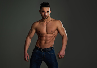 Fototapeta premium Coach sportsman with bare chest in jeans.