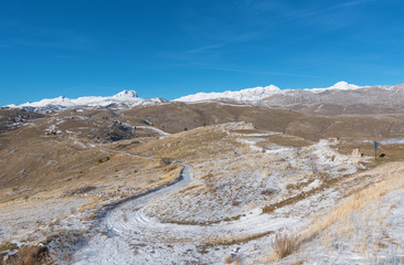 Rocca Calascio (Italy) - The ruins of an old medieval village with castle and church, over 1400 meters above sea level, on the Apennine mountains, in the heart of Abruzzo.