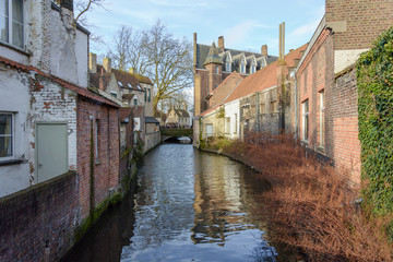 Brick buildings in Bruges with reflection of building in water,Belgium 