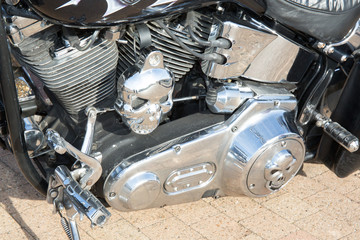 chrome motor of vintage motorcycle in street