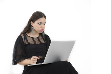 The beautiful lady is using a laptop computer