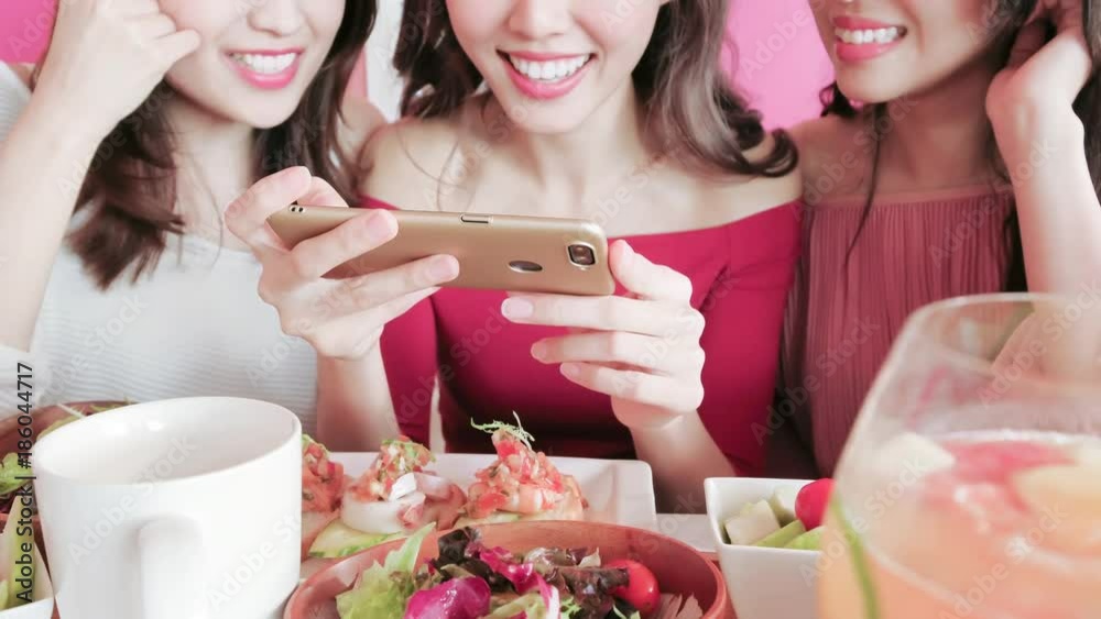 Poster woman take picture in restaurant