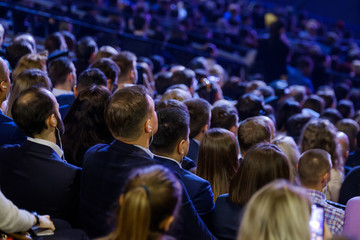 People attend business conference in the congress hall