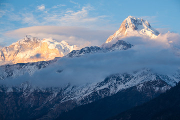 Waves of clouds around the mountains in the Annapurna range in the Himalayas of Nepal