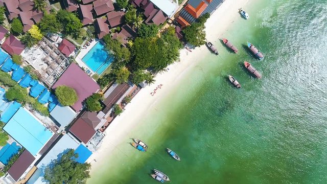 Aerial drone shot of word ZUMBA made by women on the sandy beach during beautiful summer day. Travel fitness holiday concept