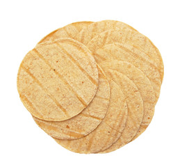 A stack of corn tortillas on a white background