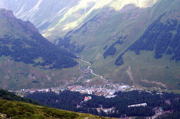 Naklejka premium City in the Caucasus mountains, top view.