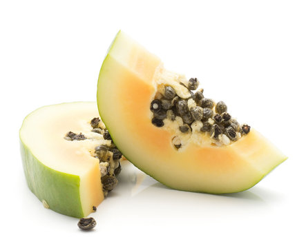 Two green papaya (pawpaw, papaw) slices isolated on white background.