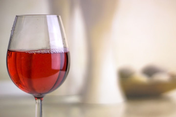 Glass of rose wine on nice background