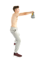 18 Year old teenage boy lifting weights