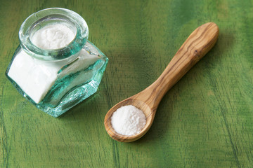 baking soda (Sodium bicarbonate) on a wooden spoon
