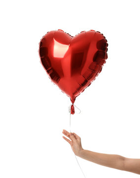 Woman hand hold single big  red heart balloon object for birthday party or valentine's day