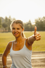 Sport is good! Sportswomen making a perfect gesture with her fingers.