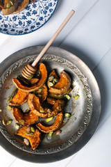 Baked pumpkin with pistachios and honey