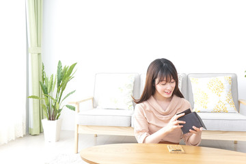 Young woman calculating domestic accounts