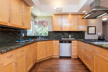 Fototapeta premium Wooden kitchen with dining table and wooden floor.