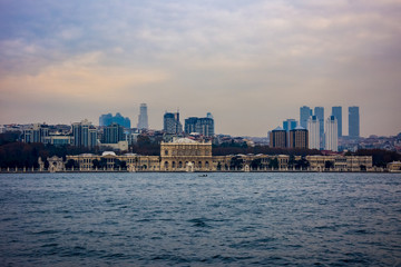Fototapeta premium Dolmabahçe Palace and skyscrapers in the background