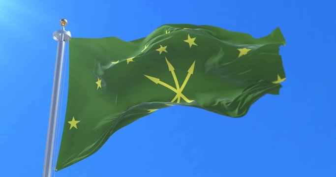 Flag of Adygea Republic waving at wind in slow in blue sky, loop