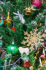 Christmas decorations on the branches of artificial trees