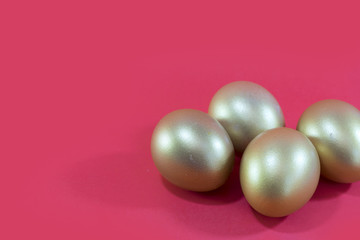 Golden egg isolated on red background.  Concept investment or Easter