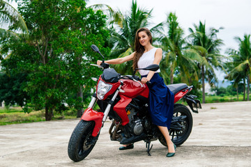 Fototapeta na wymiar Young beautiful girl on motorcycle.
