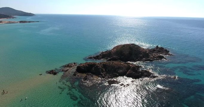 SARDINIA, ITALY  &ndash; JULY 2016 : Aerial shot over Chia Beach island on a beautiful day with sea, people and beach in view