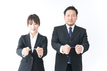 Business persons exchanging  business cards