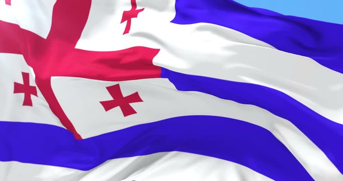 Adjara flag waving at wind in slow with blue sky, loop