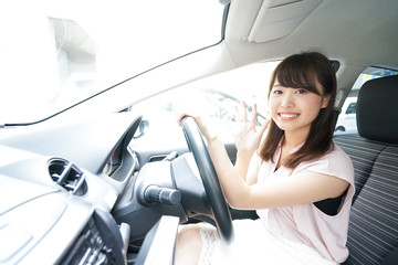 Young woman driving a car