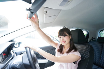 Young woman driving a car